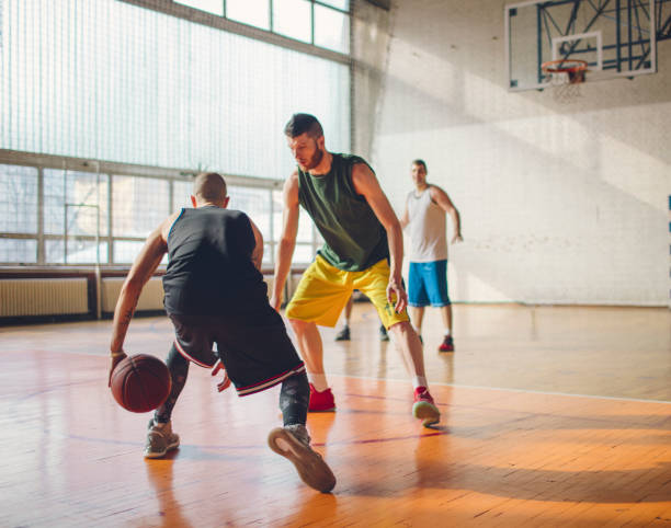 istock Group of friends playing basketball 641255894