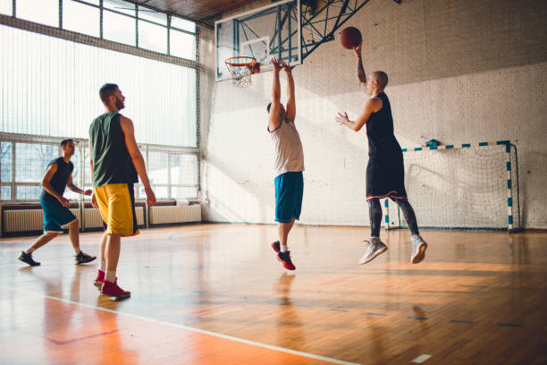 istock Group of friends playing basketball 641255966