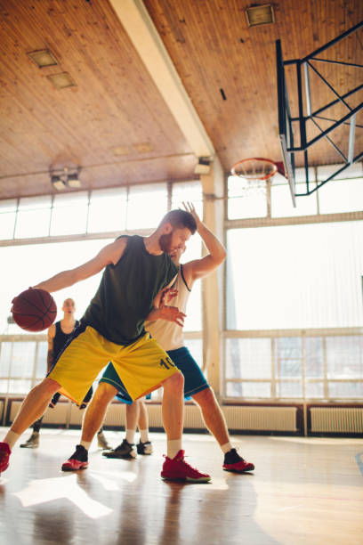 istock Group of friends playing basketball 641255992