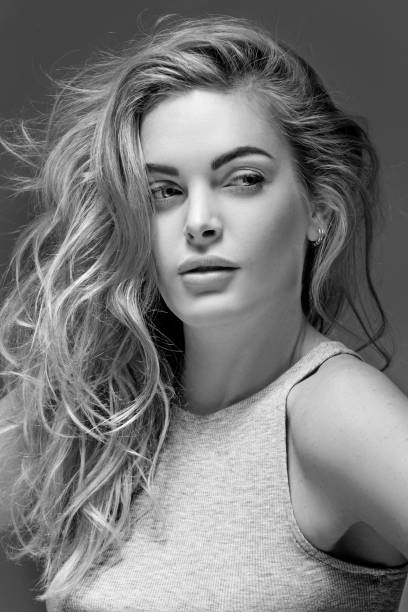 istock Beautiful long haired twenty something woman posing for studio images 641256122