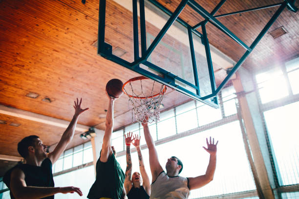 istock Group of friends playing basketball 641256128