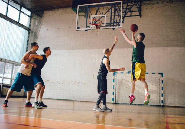 istock Group of friends playing basketball 641256180