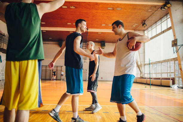 istock Group of friends playing basketball 641256268