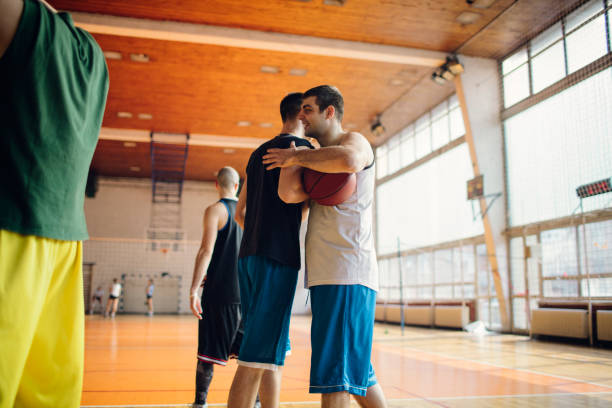 istock Group of friends playing basketball 641256304