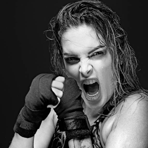 istock Beautiful long haired twenty something woman fighter posing for studio images 641256376
