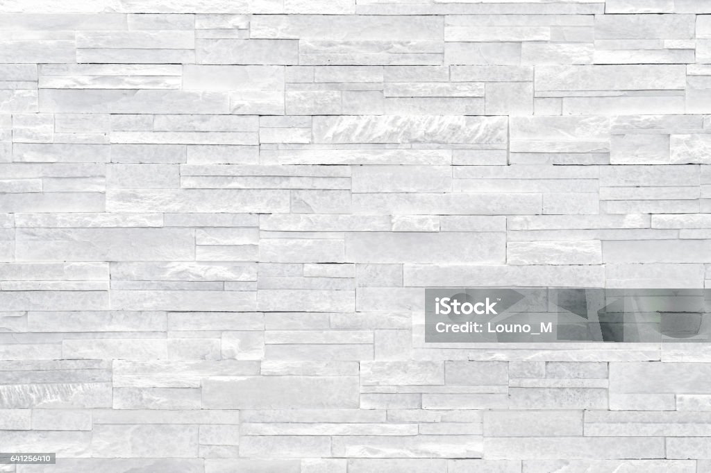 Pared de piedra fondo blanco  - Foto de stock de Pared de piedra libre de derechos