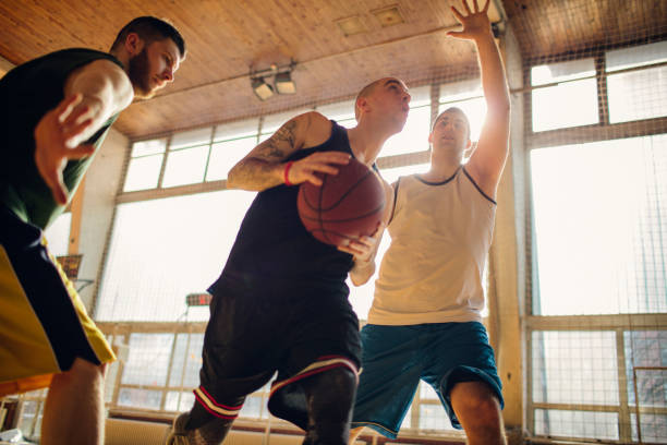 istock Group of friends playing basketball 641256436