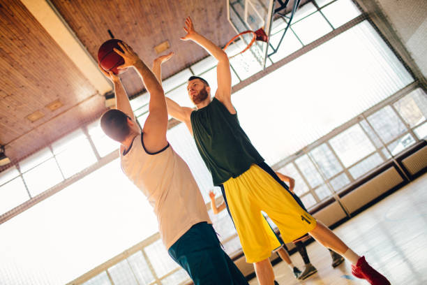 istock Group of friends playing basketball 641256664