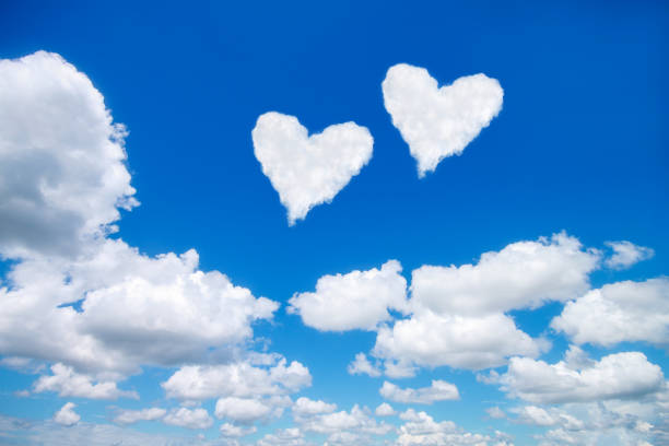 istock couple white heart shaped clouds on blue sky 641257164