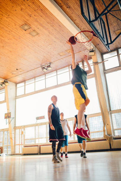 istock Group of friends playing basketball 641257250