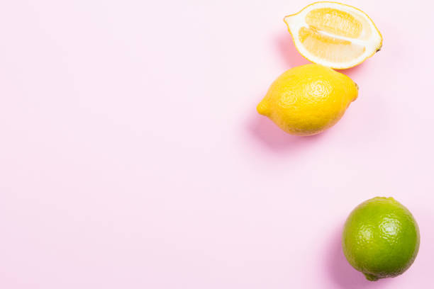 istock Several kinds of whole and cut citrus on a pink background 641257410