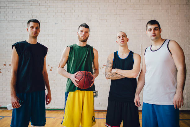 istock Group of friends playing basketball 641257604
