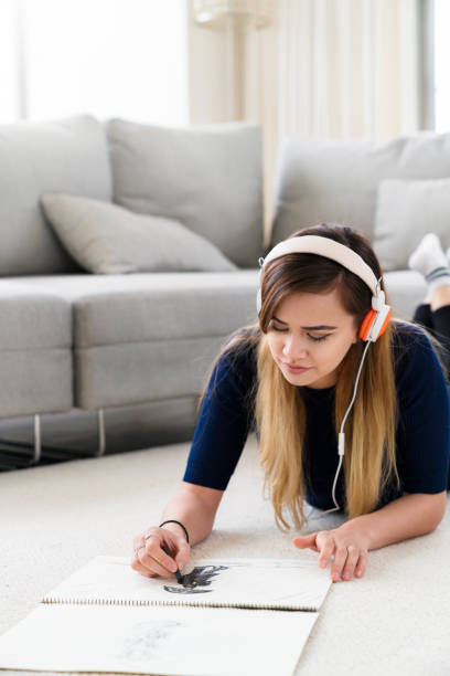 istock Woman drawing at home 641259146