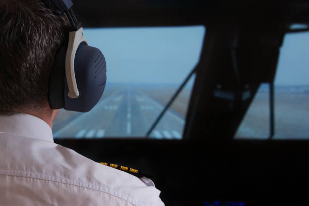 pilot in the airlpane cockpit - airplane cockpit taking off pilot imagens e fotografias de stock