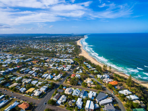 Aerial view over Dicky Beach Caloundra, Sunshine Coast, Australia Coastline at Dicky Beach in Caloundra on Queensland's Sunshine Coast, Australia headland photos stock pictures, royalty-free photos & images