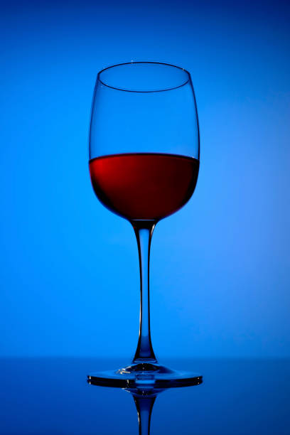 istock wineglass on the blue background 641265166