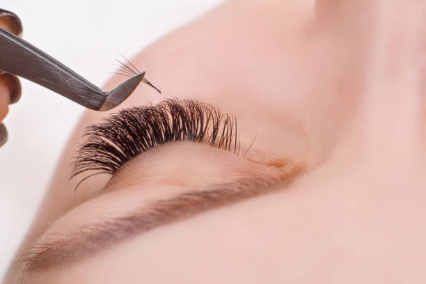 istock Eyelash Extension Procedure. Woman Eye with Long Eyelashes. 641266250