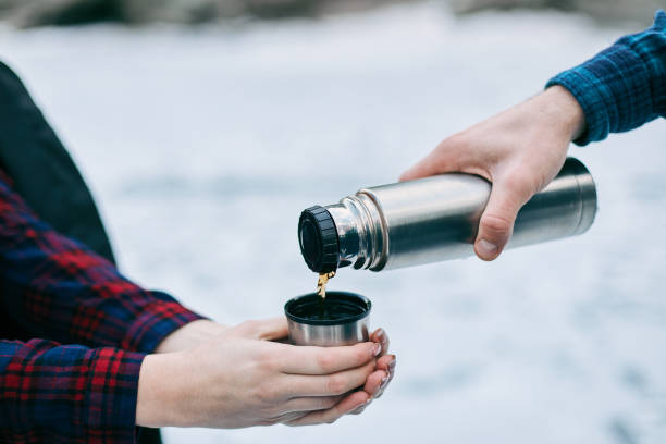 istock Top view cup of hot tea in lover's hands 641266992