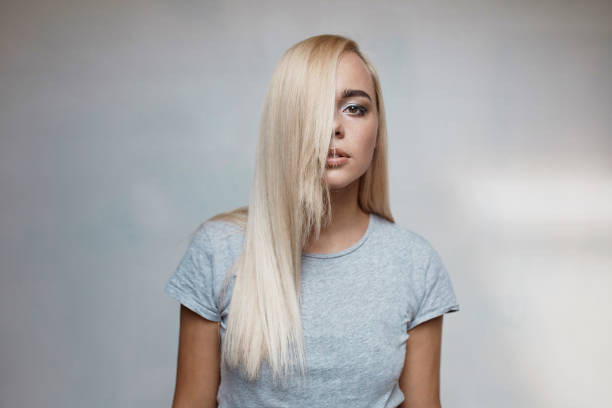 istock Pretty blonde woman posing in light room 641267732