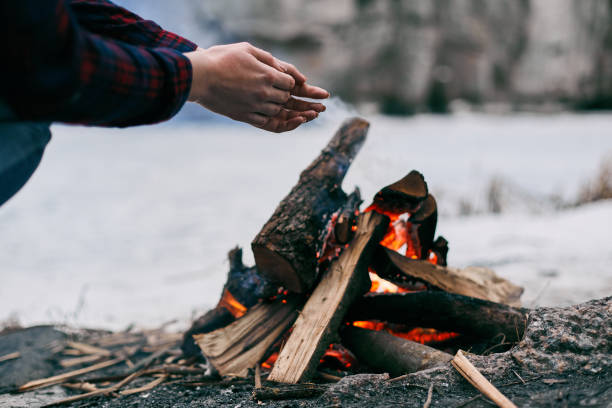 istock Girl warms hands near a fire in winter 641267782