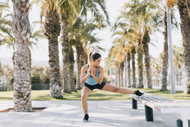 istock Woman Doing Stretching Exercises in a Park 641267792