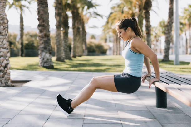 istock Woman Exercising Dips in a Park 641267868