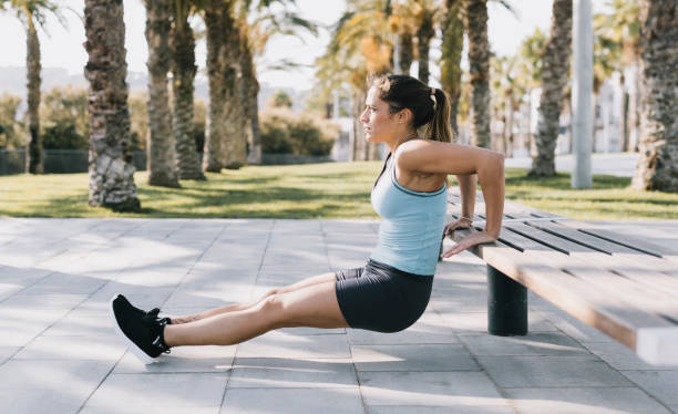 istock Woman Exercising Dips in a Park 641267890