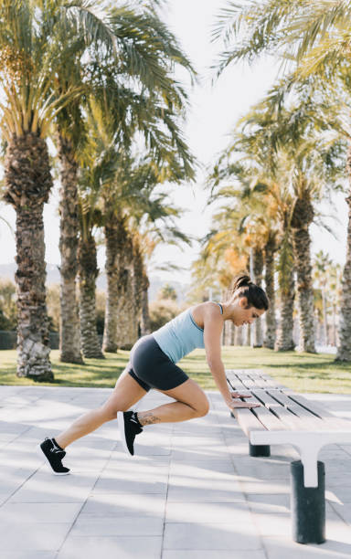 istock Woman Doing Jumping Exercises in a Park 641267926