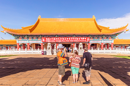 Tourists at the Nan Hua Temple the largest Buddhist temple and seminary in Africa, it is situated in Bronkhorstspruit, South Africa. Taken during the New Year festivities. It covers an area of 600 acres and is the African headquarters of the Fo Guang Shan Order.