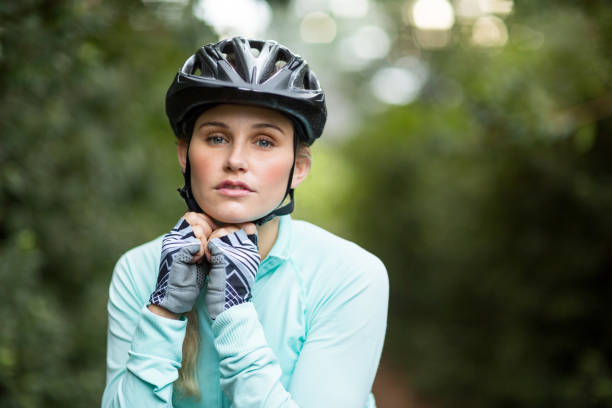istock Confident female athletic wearing bicycle helmet 641273318