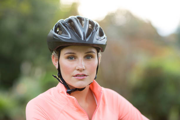 istock Confident female athletic wearing bicycle helmet 641273326