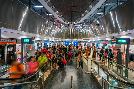 Passengers can be seen at the Harbourfront MRT station in Singapore city