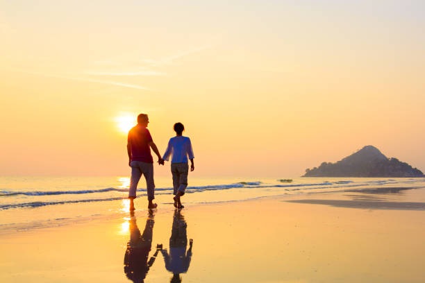 istock Senior couple at golden beach 641273682