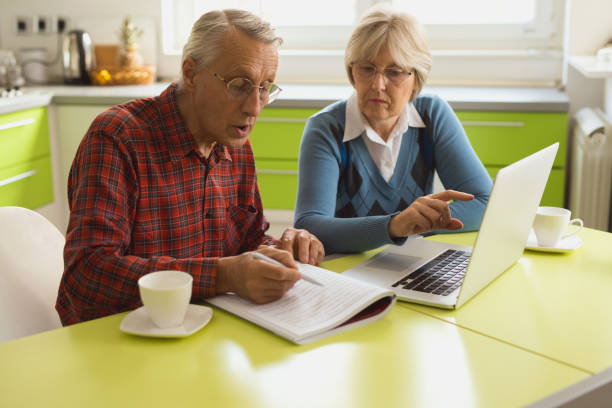 istock Senior couple is using laptop to organize their finances. 641273882