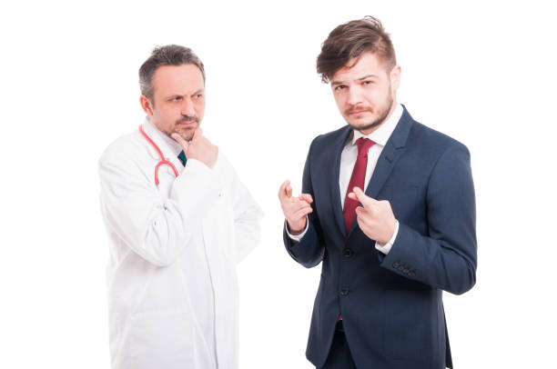 istock Pensive medic and young businessman 641277212
