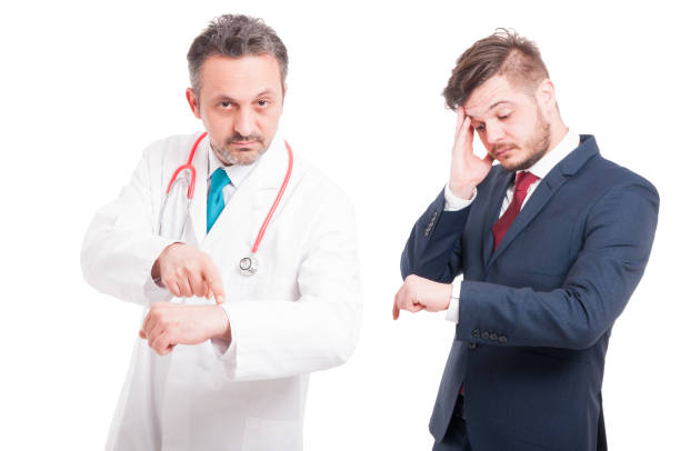 istock Sick director standing near medic or doctor 641277678