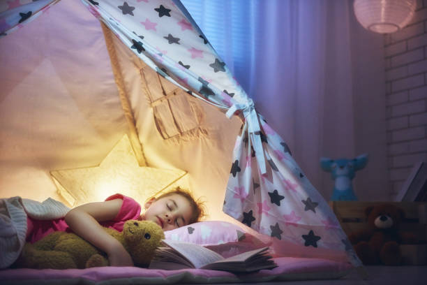 istock girl is napping in the tent 641279790