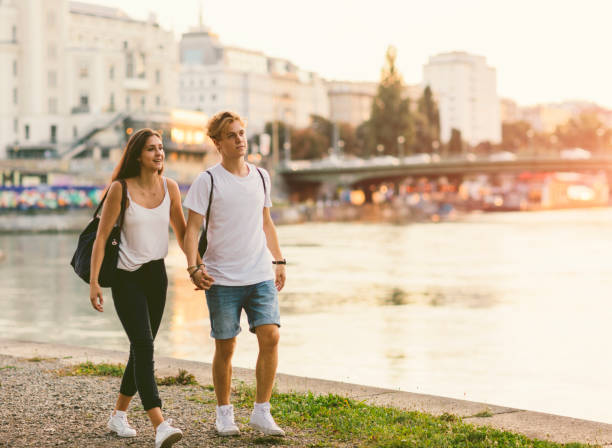 istock Teen couple walking by the river 641281786