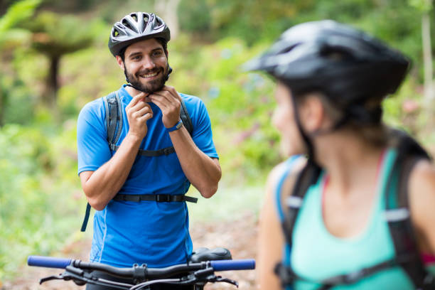 istock Male athletic wearing bicycle helmet in forest 641283644