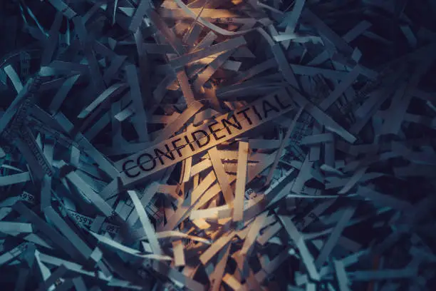 Shredded paper and word Confidetial