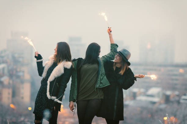 istock Happy Young Women Having Fun With Firewors 641286358