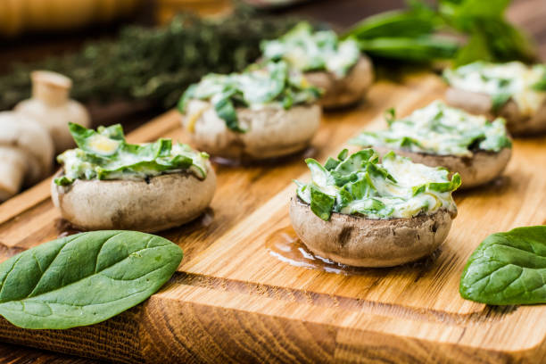 istock Cooked mushrooms stuffed with spinach and cheese 641287184