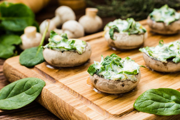 istock Cooked mushrooms stuffed with spinach and cheese 641287212