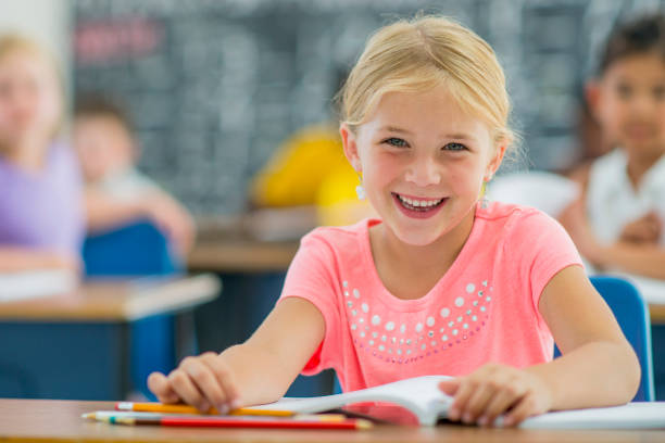 istock A multi-ethnic group of elementary age students are sitting in their desks in class. 641287870