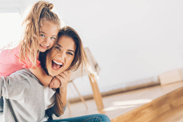 Mother and daughther happy together Young woman and small girl having a great time together family with one child stock pictures, royalty-free photos & images