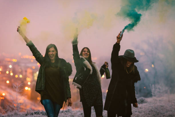istock Happy Young Women Having Fun With smoke bomb 641289340