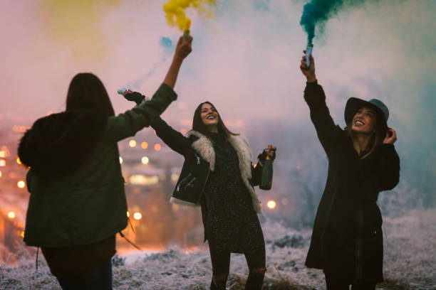 istock Happy Young Women Having Fun With smoke bomb 641291708