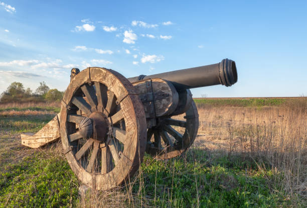 istock Old cannon with wooden wheels in the field 641291714