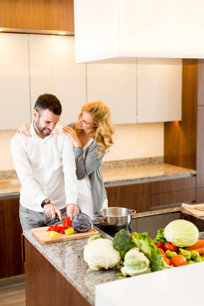 istock Young loving couple preparing tasty meal 641292724