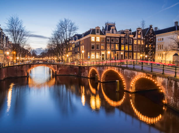 Amsterdam canals and bridges in the evening stock photo